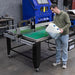 Man Pouring Eastwood CNC Plasma Cutting Table Fluid - 5 Gallon into CNC Table