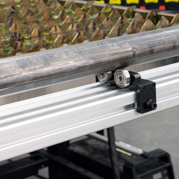 Replacement bearing guide riding on the support rail of the Versa-Cut tubing notcher
