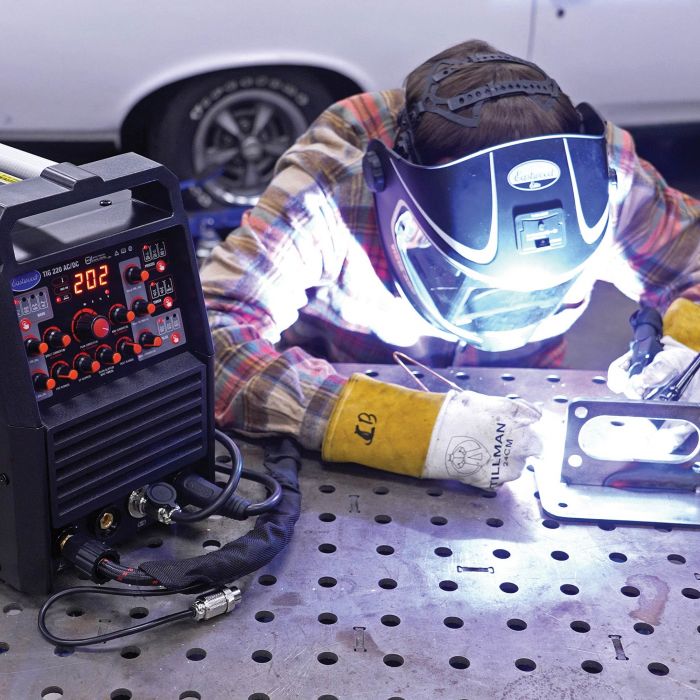 Close-up of the Eastwood TIG 220 AC/DC welder digital control panel during welding
