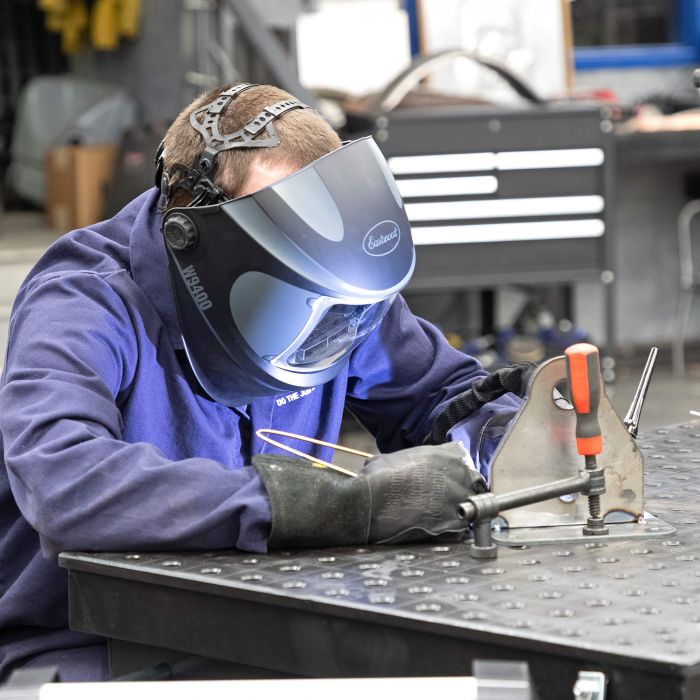 Welder using the Eastwood W9400 Wide View welding helmet during a fabrication project.