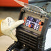 Close-up of the Rockwood MIG 160 digital controls during welding
